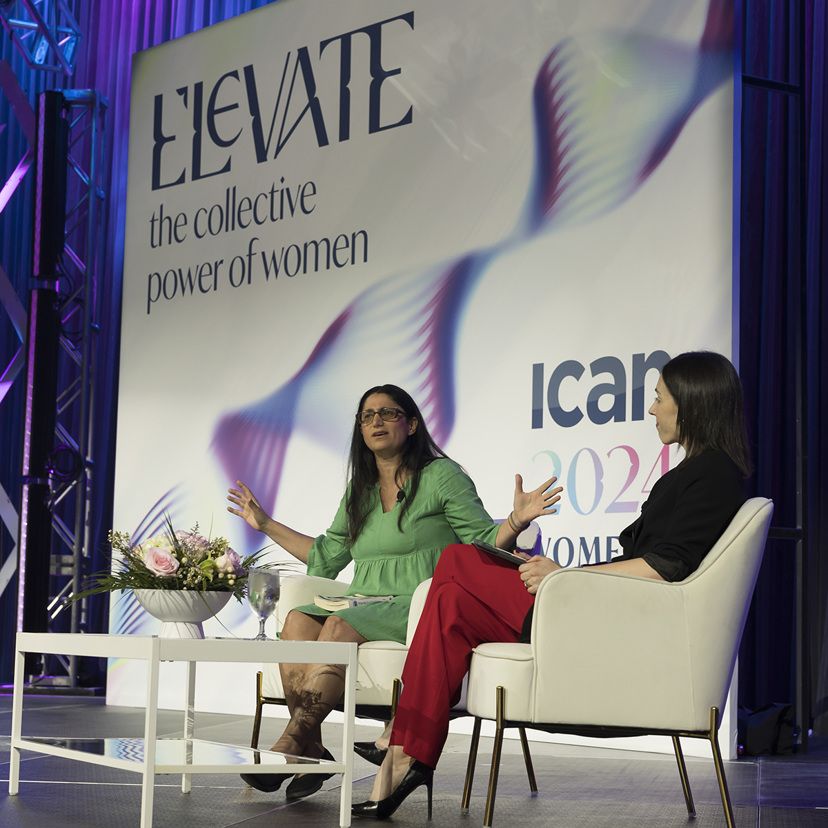 Two women sitting on stage at the ICAN Women's leadership Conference in 2024.