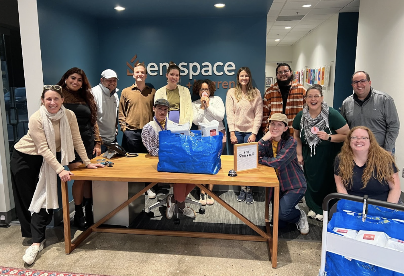 Emspace + Lovgren team members pose with their bags of menstrual supply kits 