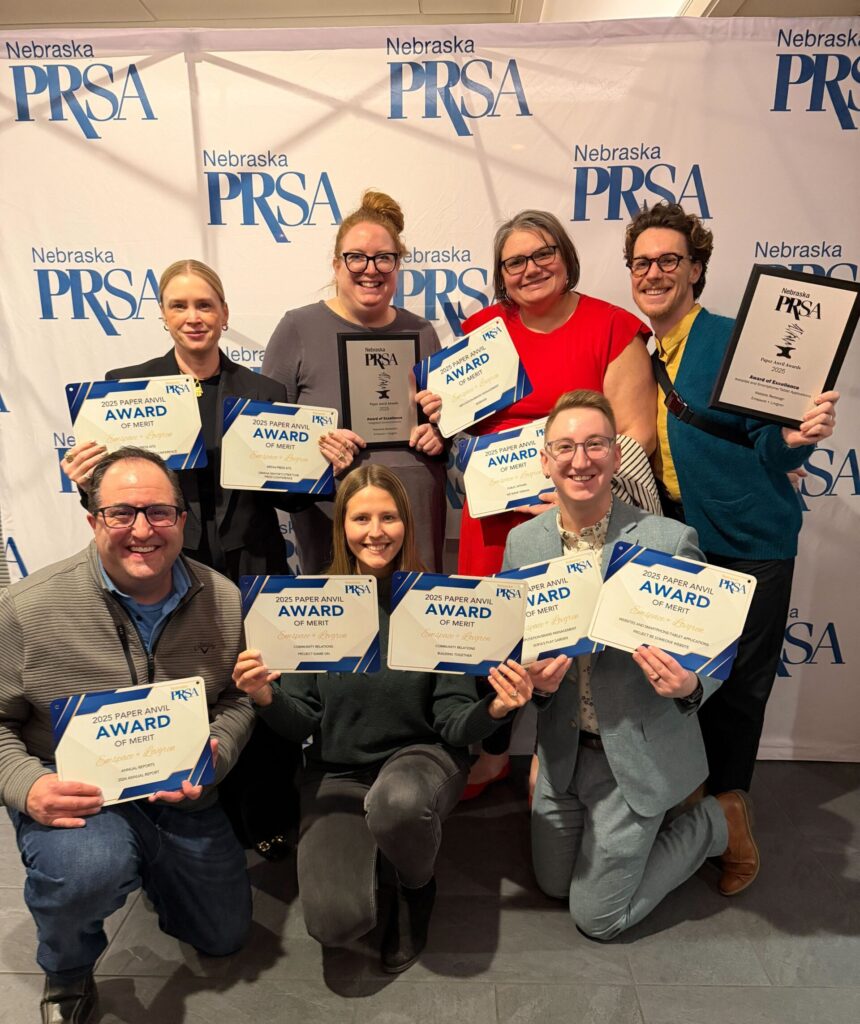 The Emspace team holding award from the 2025 PRSA awards.